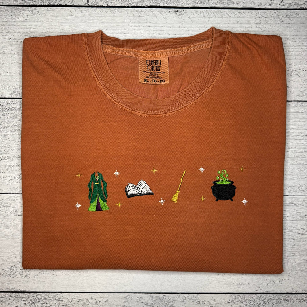 
                      
                        Spell Book Witch Tee
                      
                    